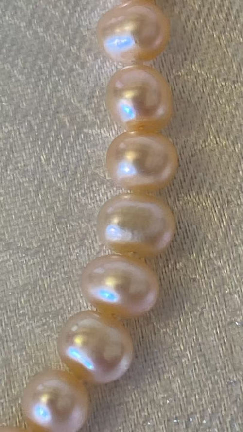 Close-up of peach and gold pearls with fine lustre