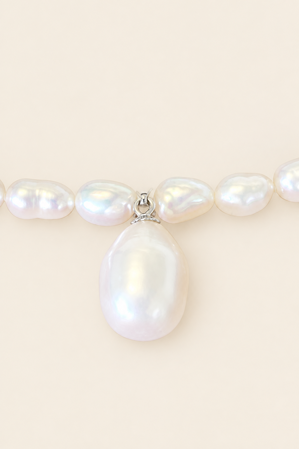 Close-up of 13.4mm brilliant white bottle drop pearl