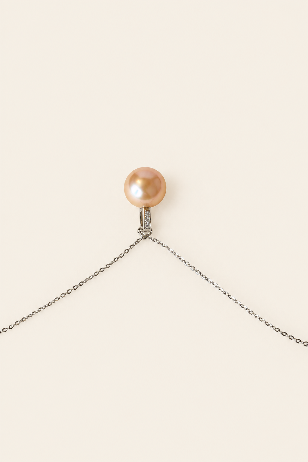 Peach Blossom 12mm golden peach pearl pendant on light beige