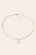 Moon Drop white pearl necklace with drop pearl on light beige